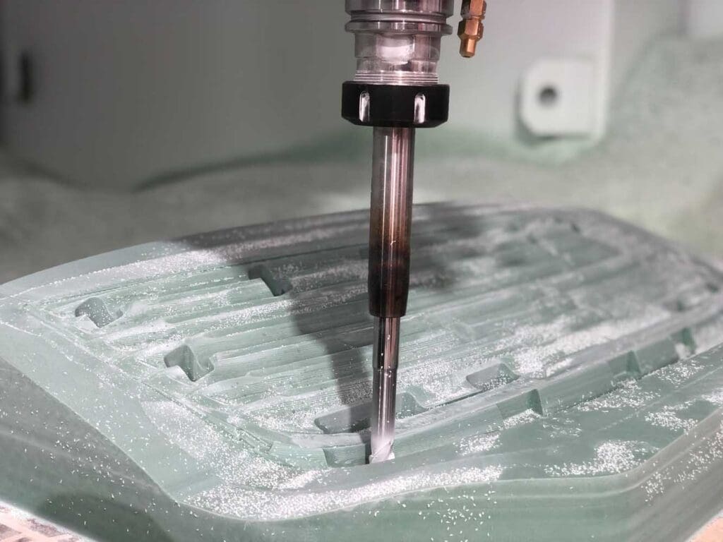 Custom machined tooling used for adaptable production of Porsche ducktail mouldings at ID Mouldings